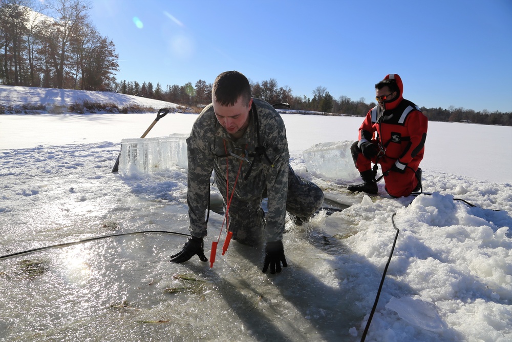 Cold-Weather Operations Course students battle icy conditions in cold-water immersion training at Fort McCoy