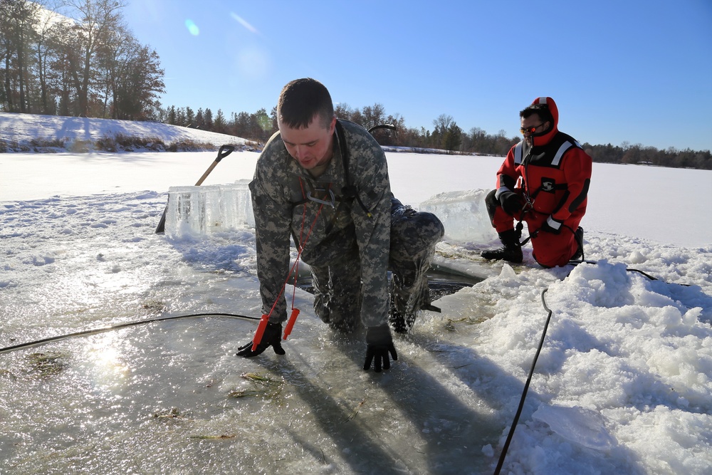 Cold-Weather Operations Course students battle icy conditions in cold-water immersion training at Fort McCoy