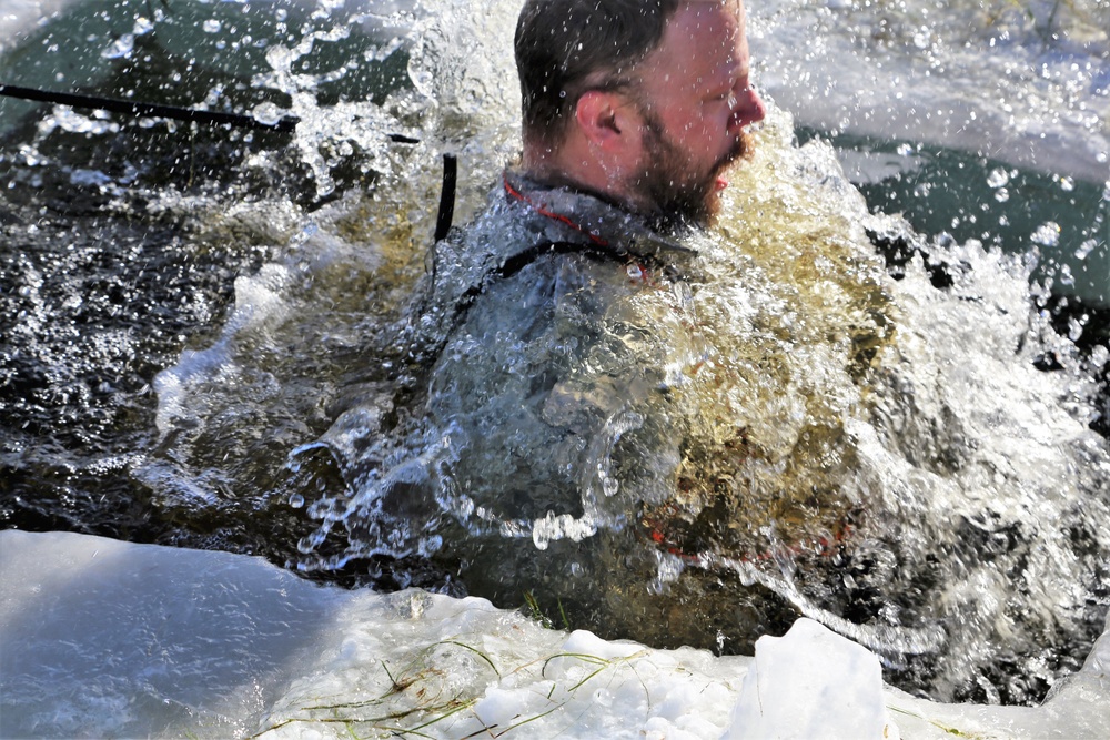 Cold-Weather Operations Course students battle icy conditions in cold-water immersion training at Fort McCoy