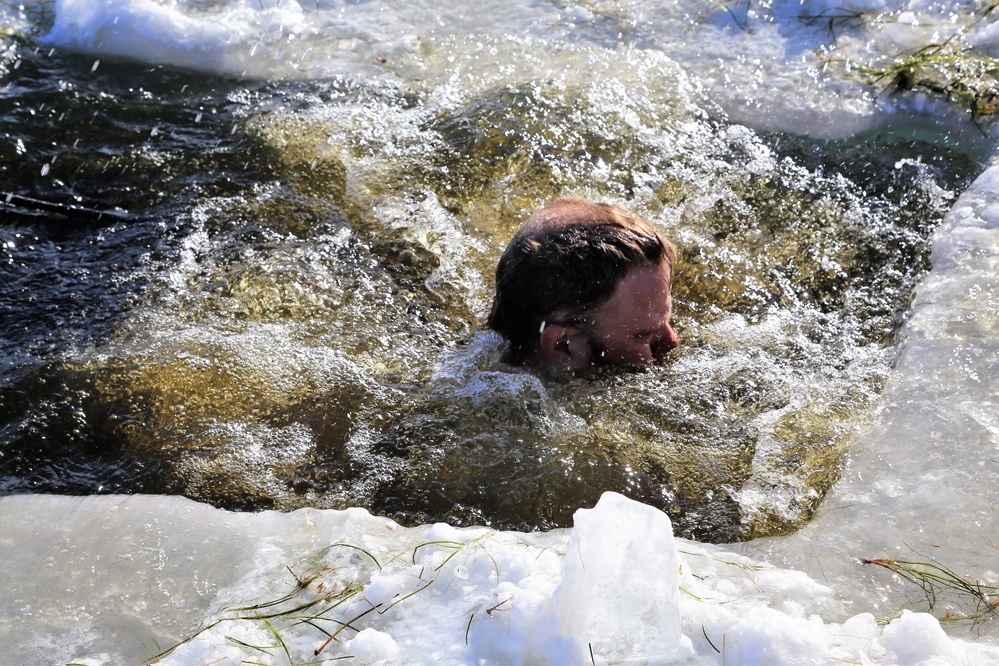 Cold-Weather Operations Course students battle icy conditions in cold-water immersion training at Fort McCoy