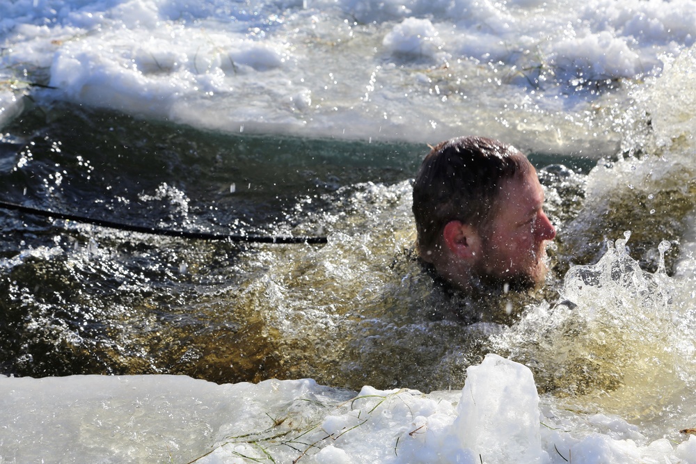 Cold-Weather Operations Course students battle icy conditions in cold-water immersion training at Fort McCoy