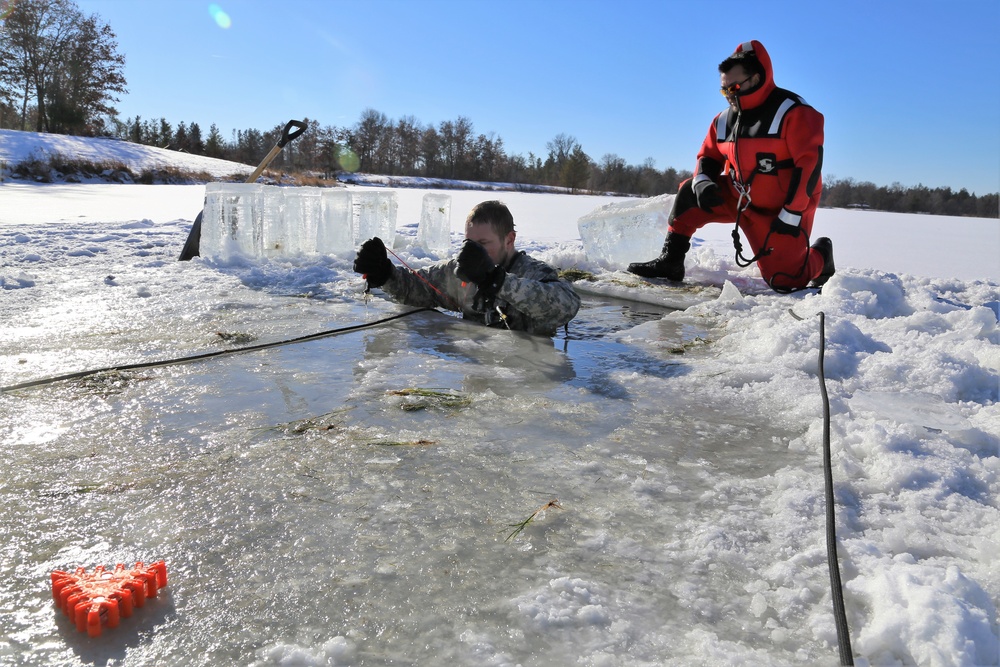 Cold-Weather Operations Course students battle icy conditions in cold-water immersion training at Fort McCoy