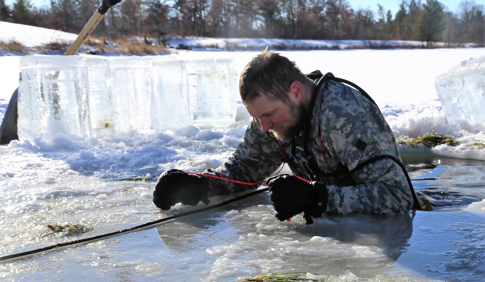 Cold-Weather Operations Course students battle icy conditions in cold-water immersion training at Fort McCoy