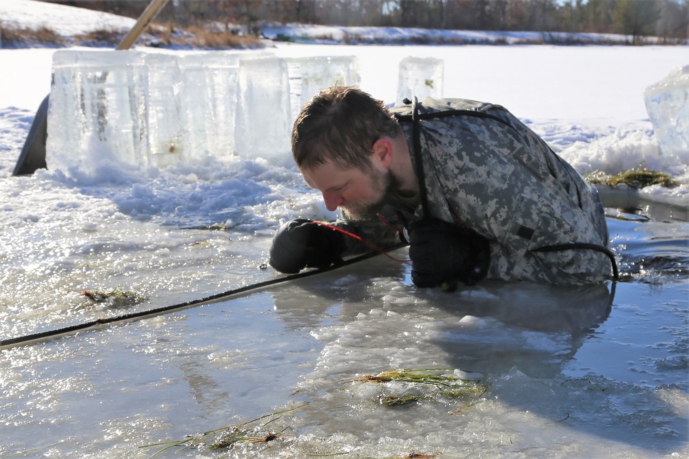 Cold-Weather Operations Course students battle icy conditions in cold-water immersion training at Fort McCoy