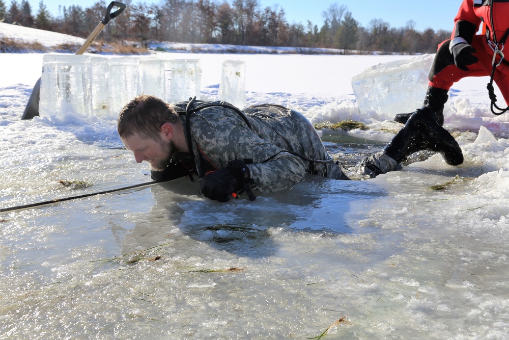 Cold-Weather Operations Course students battle icy conditions in cold-water immersion training at Fort McCoy