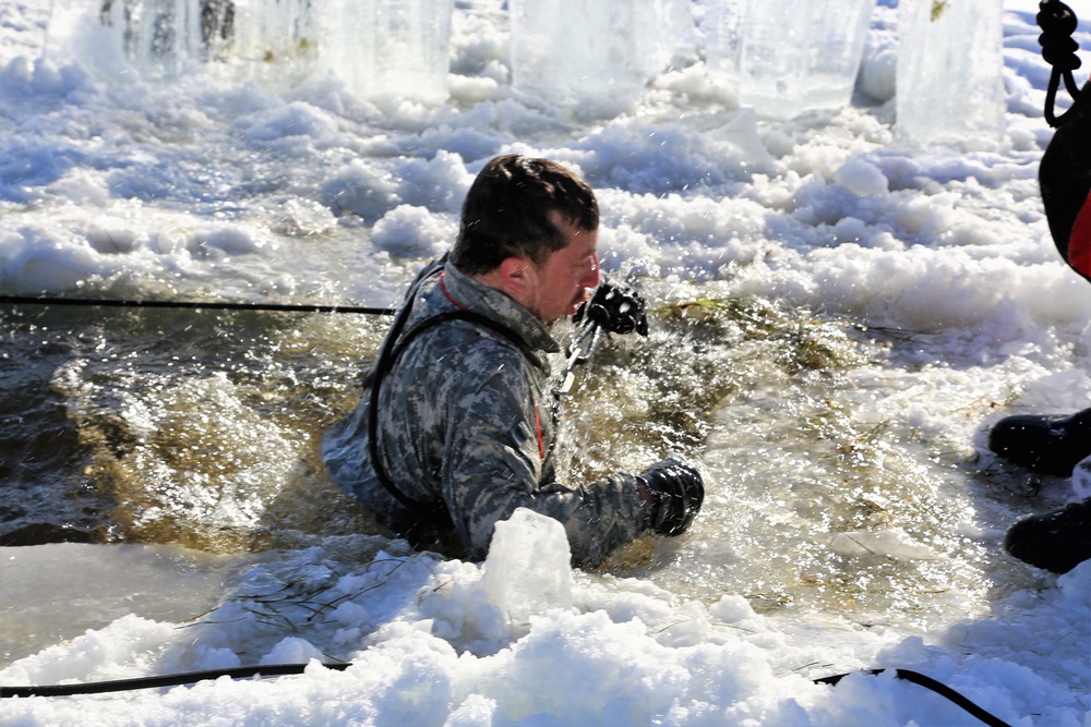 Cold-Weather Operations Course students battle icy conditions in cold-water immersion training at Fort McCoy