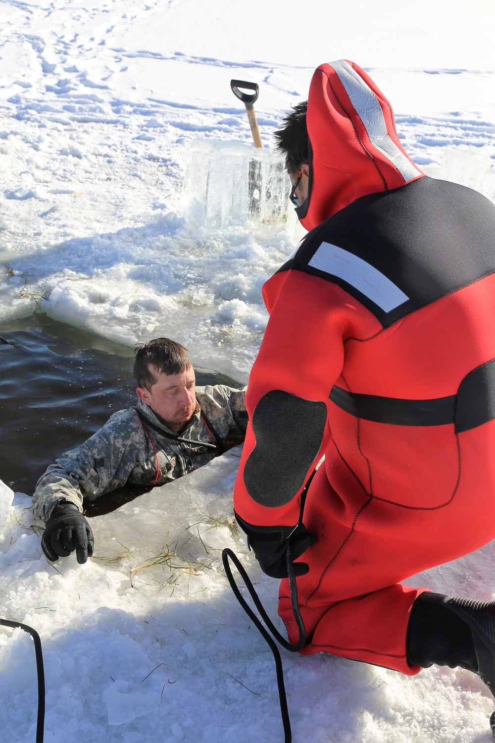 Cold-Weather Operations Course students battle icy conditions in cold-water immersion training at Fort McCoy