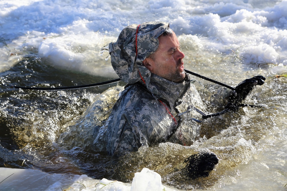 Cold-Weather Operations Course students battle icy conditions in cold-water immersion training at Fort McCoy