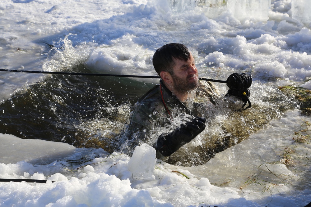 Cold-Weather Operations Course students battle icy conditions in cold-water immersion training at Fort McCoy