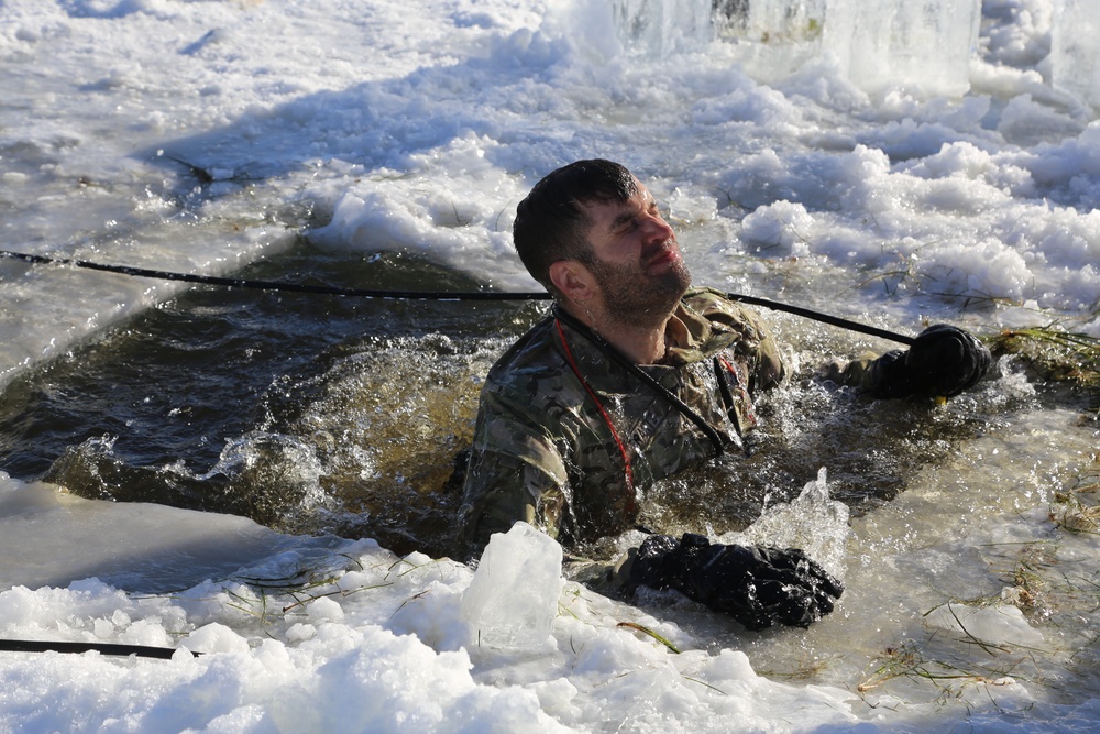 Cold-Weather Operations Course students battle icy conditions in cold-water immersion training at Fort McCoy