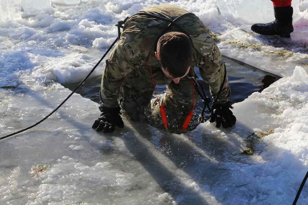 Cold-Weather Operations Course students battle icy conditions in cold-water immersion training at Fort McCoy