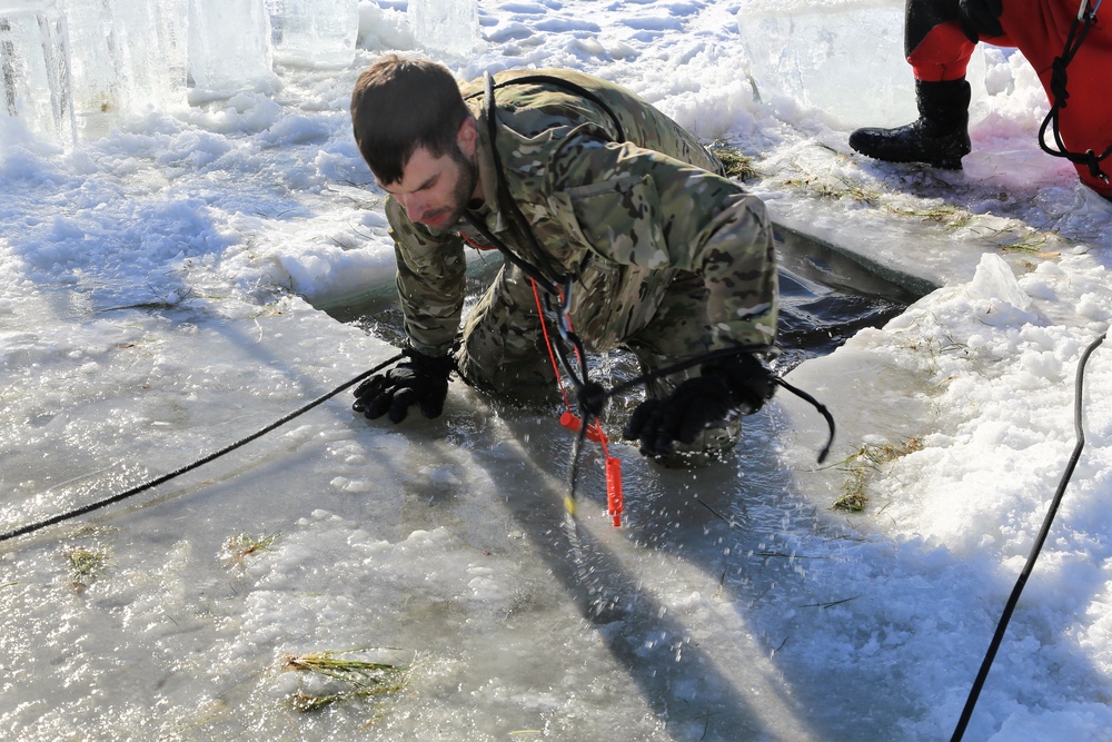 Cold-Weather Operations Course students battle icy conditions in cold-water immersion training at Fort McCoy