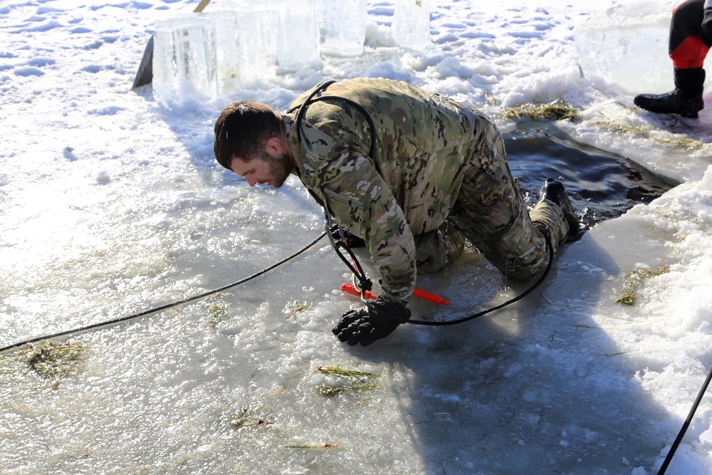 Cold-Weather Operations Course students battle icy conditions in cold-water immersion training at Fort McCoy