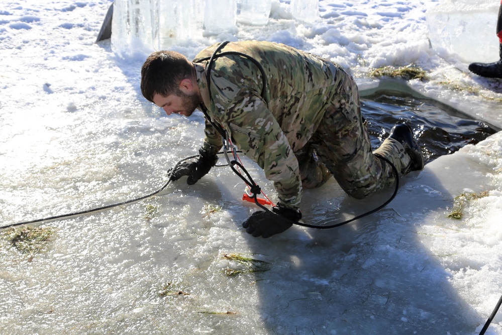 Cold-Weather Operations Course students battle icy conditions in cold-water immersion training at Fort McCoy