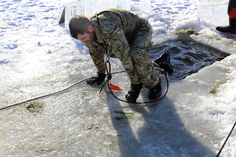 Cold-Weather Operations Course students battle icy conditions in cold-water immersion training at Fort McCoy