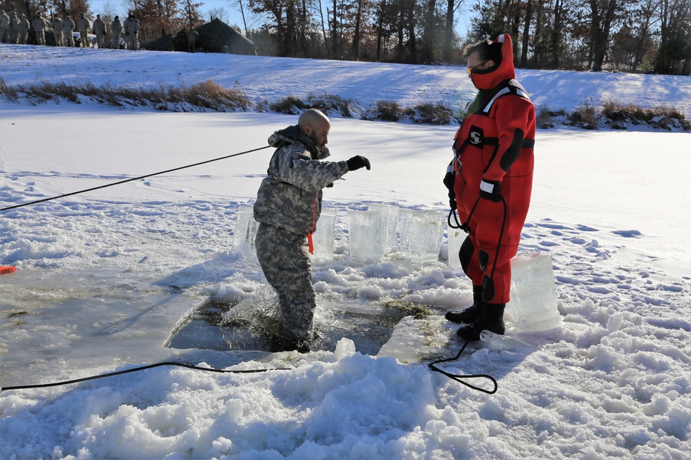 Cold-Weather Operations Course students battle icy conditions in cold-water immersion training at Fort McCoy