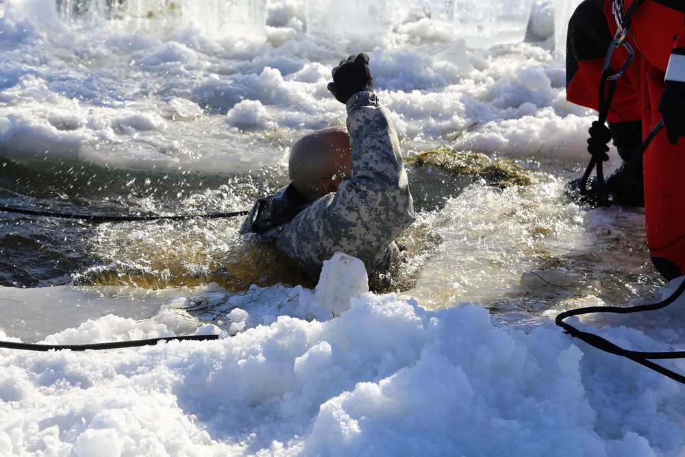 Cold-Weather Operations Course students battle icy conditions in cold-water immersion training at Fort McCoy