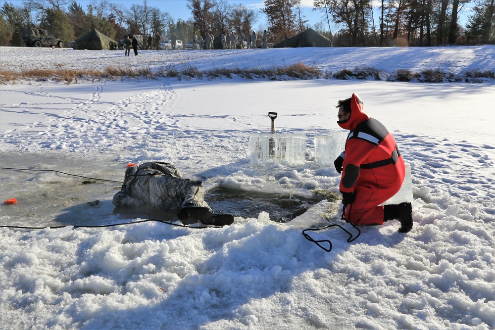 Cold-Weather Operations Course students battle icy conditions in cold-water immersion training at Fort McCoy