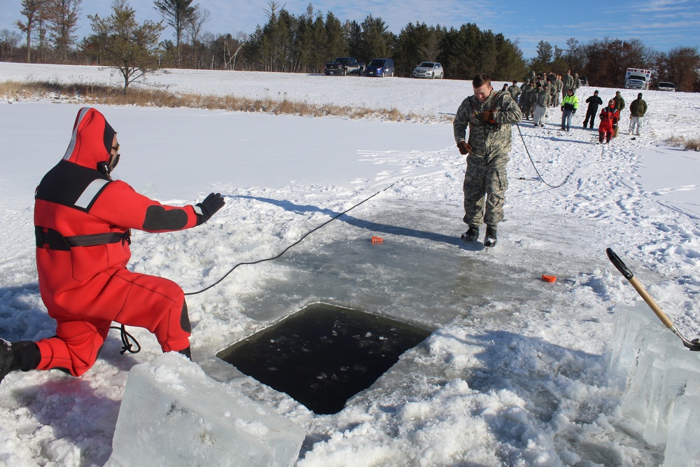 Students take plunge in icy water for Cold-Weather Operations Course 18-02 at Fort McCoy