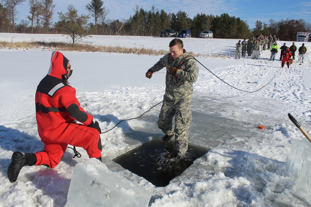 Students take plunge in icy water for Cold-Weather Operations Course 18-02 at Fort McCoy