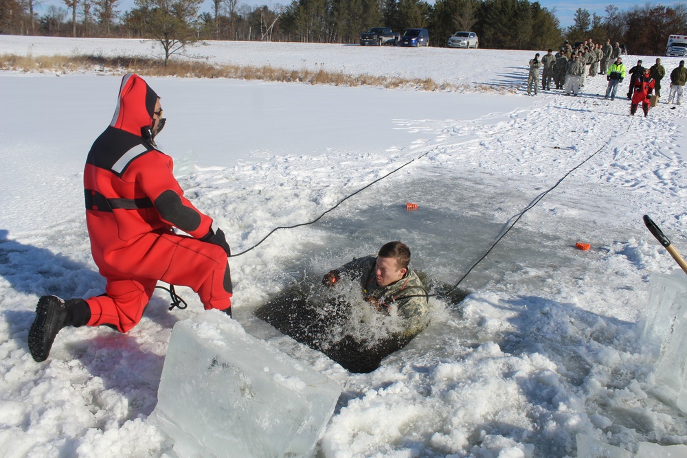 Students take plunge in icy water for Cold-Weather Operations Course 18-02 at Fort McCoy