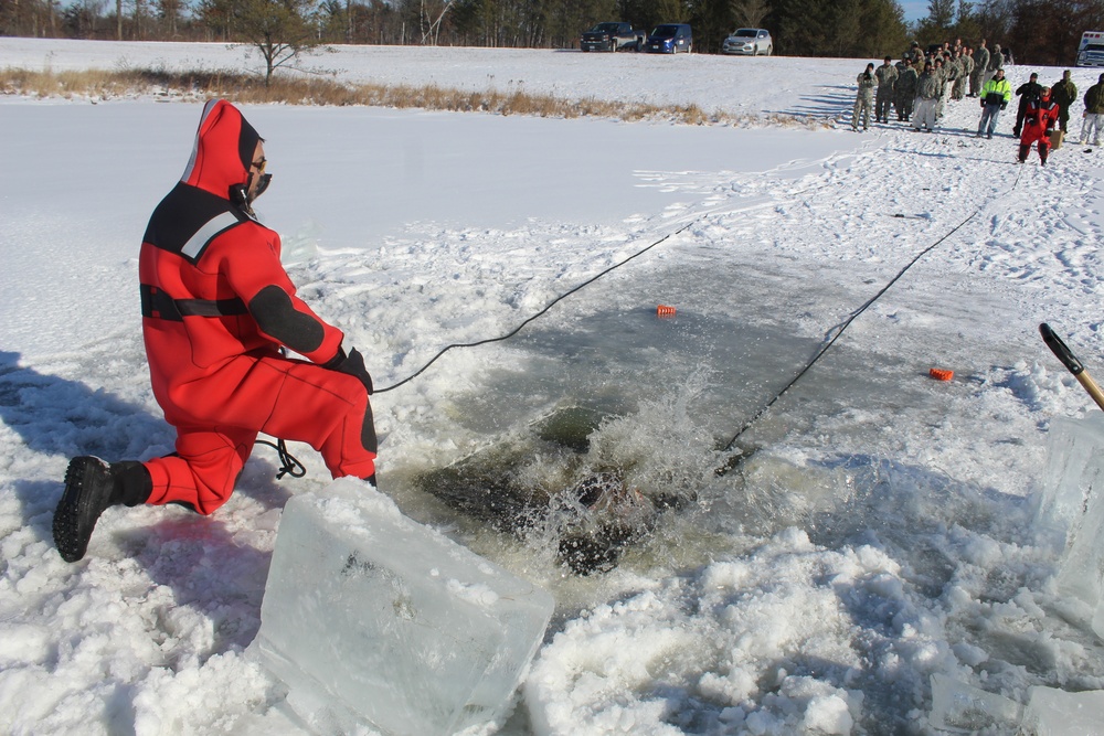 Students take plunge in icy water for Cold-Weather Operations Course 18-02 at Fort McCoy