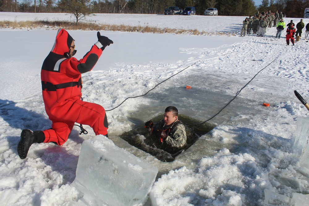 Students take plunge in icy water for Cold-Weather Operations Course 18-02 at Fort McCoy