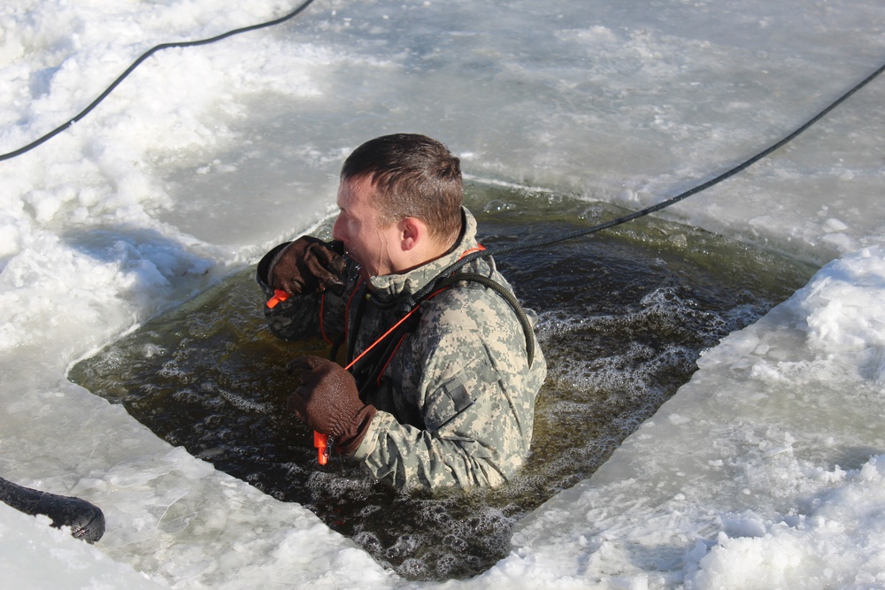 Students take plunge in icy water for Cold-Weather Operations Course 18-02 at Fort McCoy