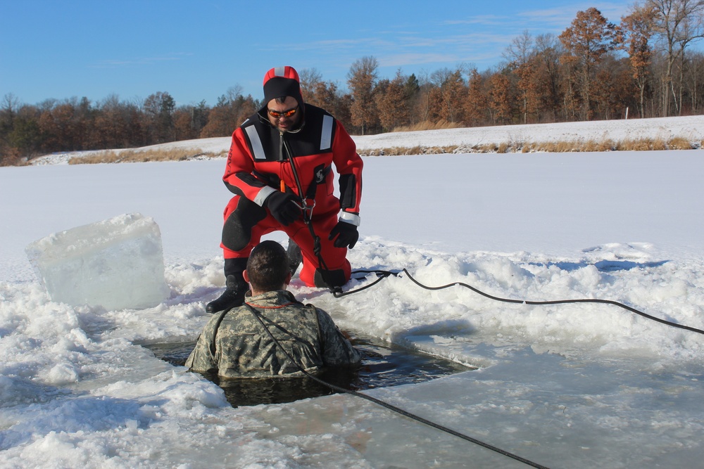 Students take plunge in icy water for Cold-Weather Operations Course 18-02 at Fort McCoy