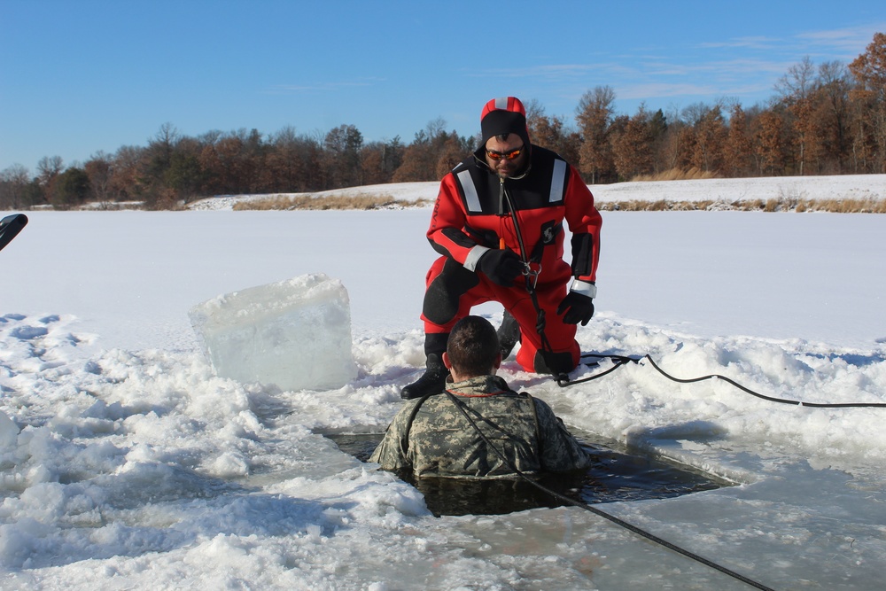 Students take plunge in icy water for Cold-Weather Operations Course 18-02 at Fort McCoy