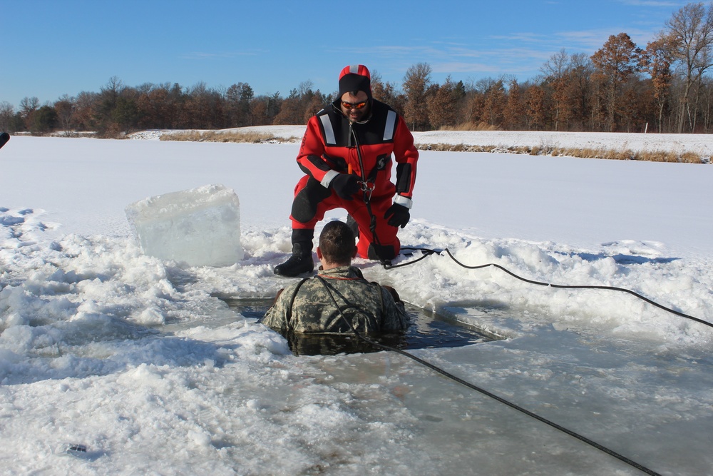 Students take plunge in icy water for Cold-Weather Operations Course 18-02 at Fort McCoy