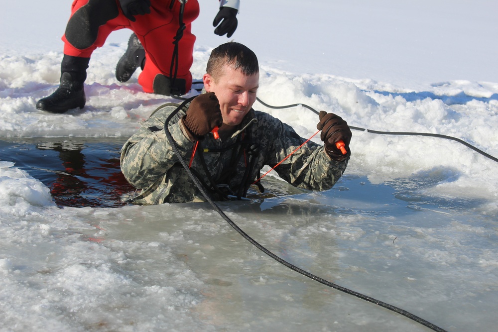 Students take plunge in icy water for Cold-Weather Operations Course 18-02 at Fort McCoy