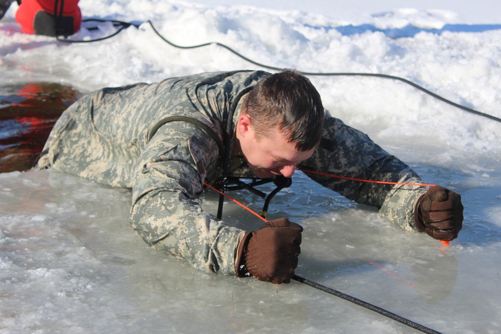 Students take plunge in icy water for Cold-Weather Operations Course 18-02 at Fort McCoy