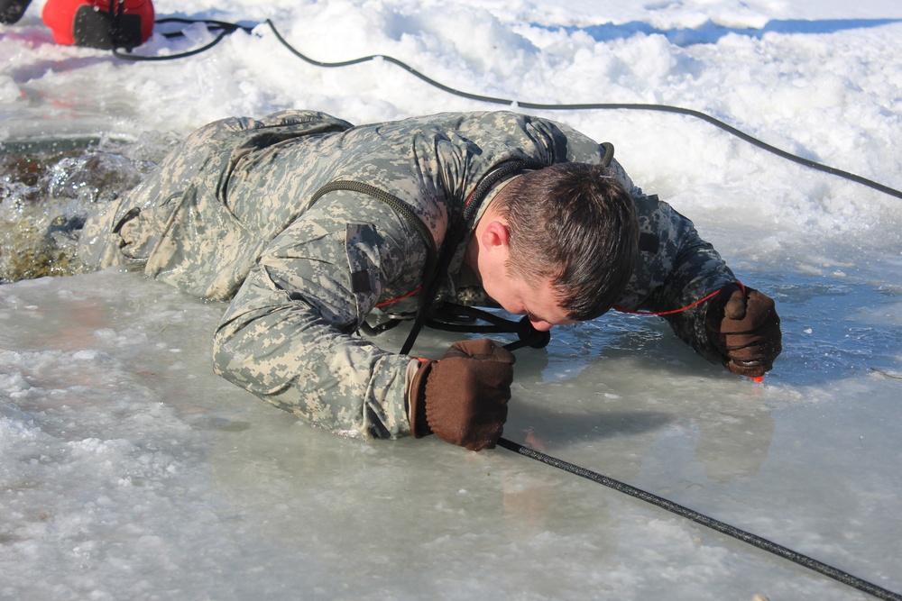 Students take plunge in icy water for Cold-Weather Operations Course 18-02 at Fort McCoy