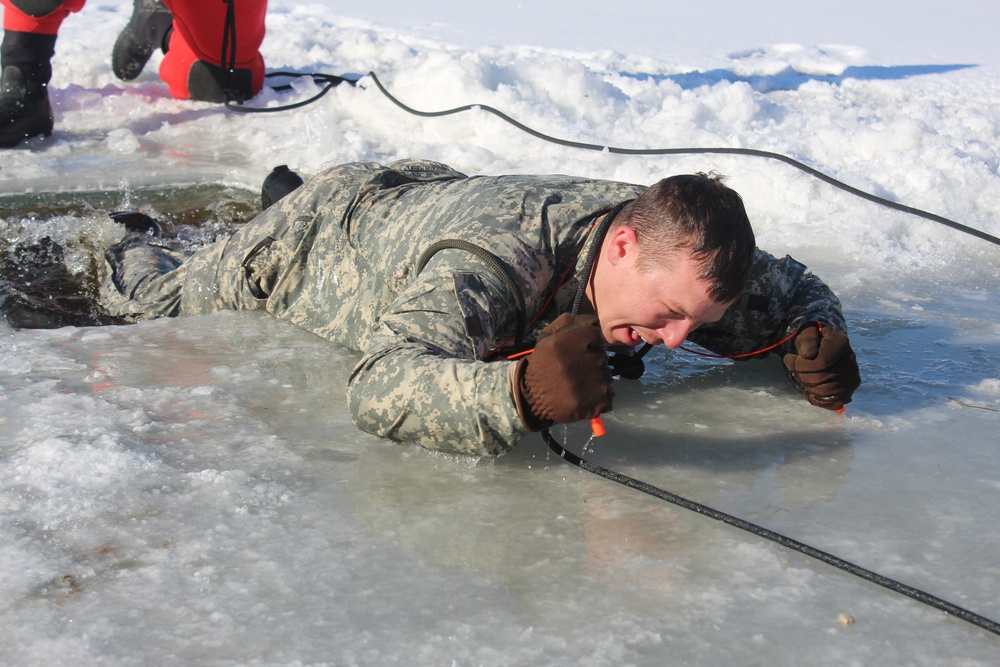 Students take plunge in icy water for Cold-Weather Operations Course 18-02 at Fort McCoy