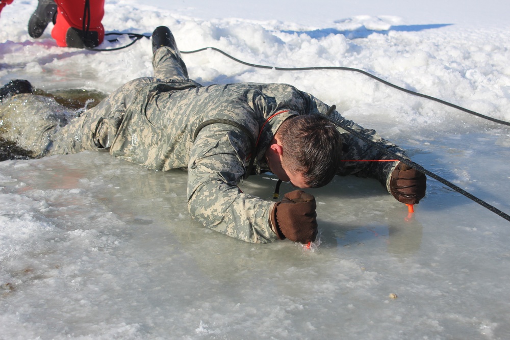 Students take plunge in icy water for Cold-Weather Operations Course 18-02 at Fort McCoy