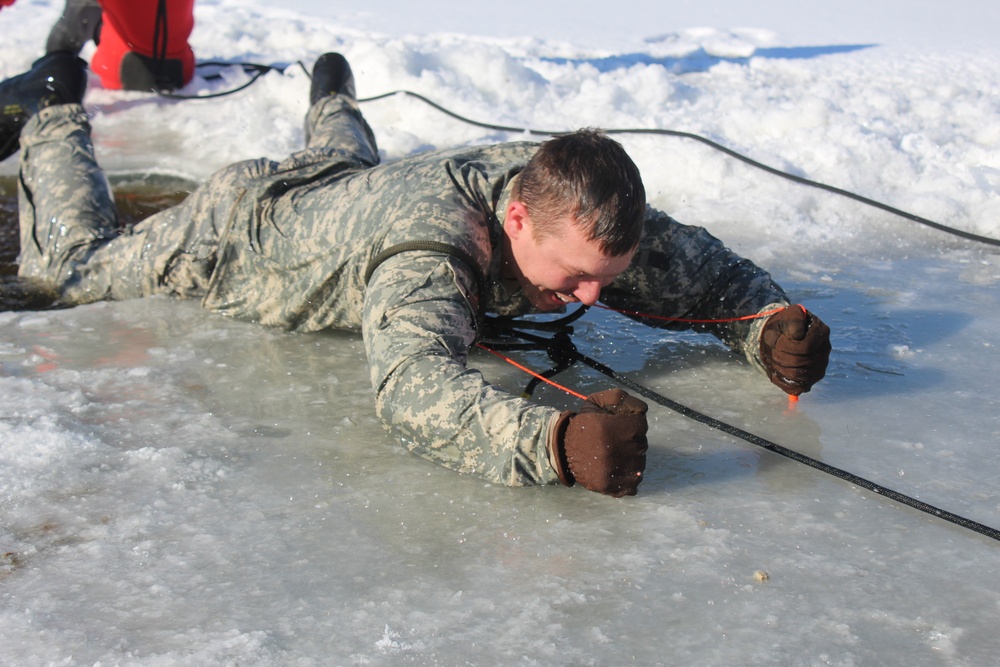 Students take plunge in icy water for Cold-Weather Operations Course 18-02 at Fort McCoy