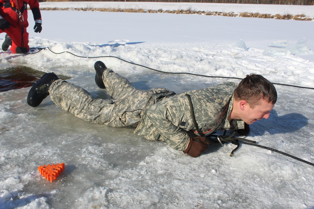 Students take plunge in icy water for Cold-Weather Operations Course 18-02 at Fort McCoy