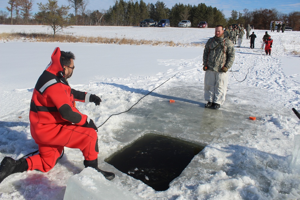 Students take plunge in icy water for Cold-Weather Operations Course 18-02 at Fort McCoy