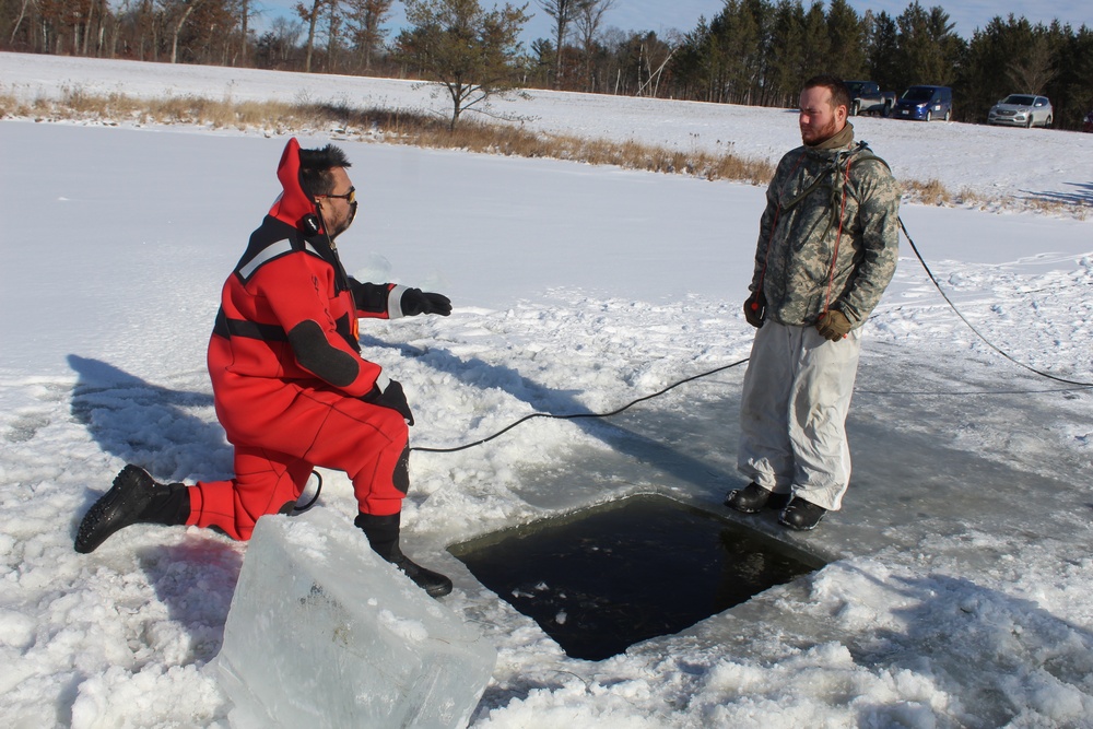 Students take plunge in icy water for Cold-Weather Operations Course 18-02 at Fort McCoy