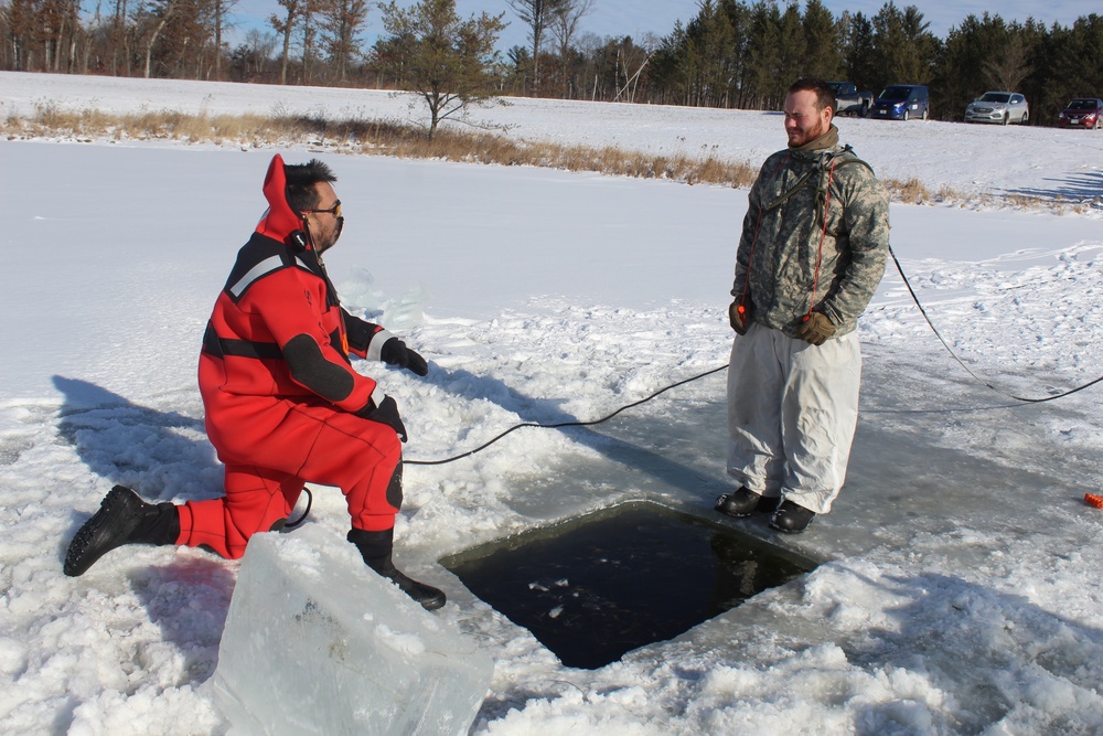 Students take plunge in icy water for Cold-Weather Operations Course 18-02 at Fort McCoy