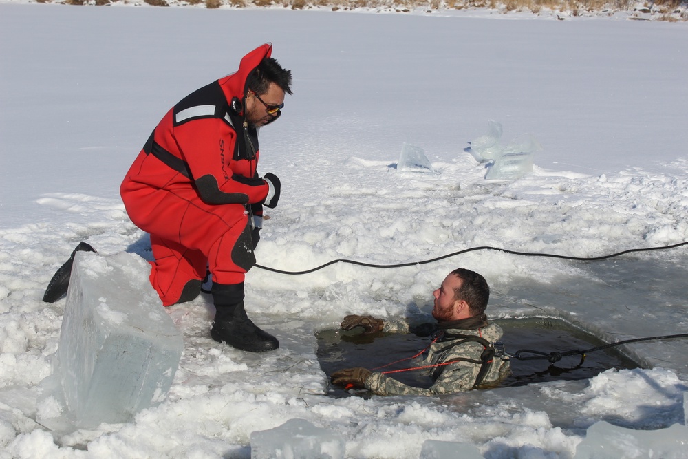 Students take plunge in icy water for Cold-Weather Operations Course 18-02 at Fort McCoy