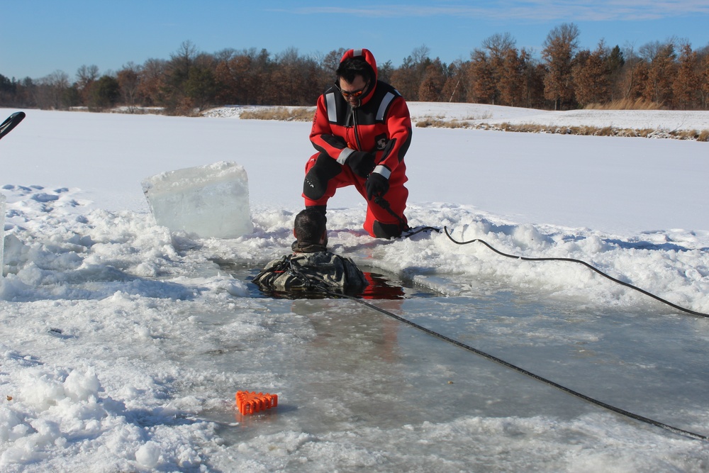 Students take plunge in icy water for Cold-Weather Operations Course 18-02 at Fort McCoy