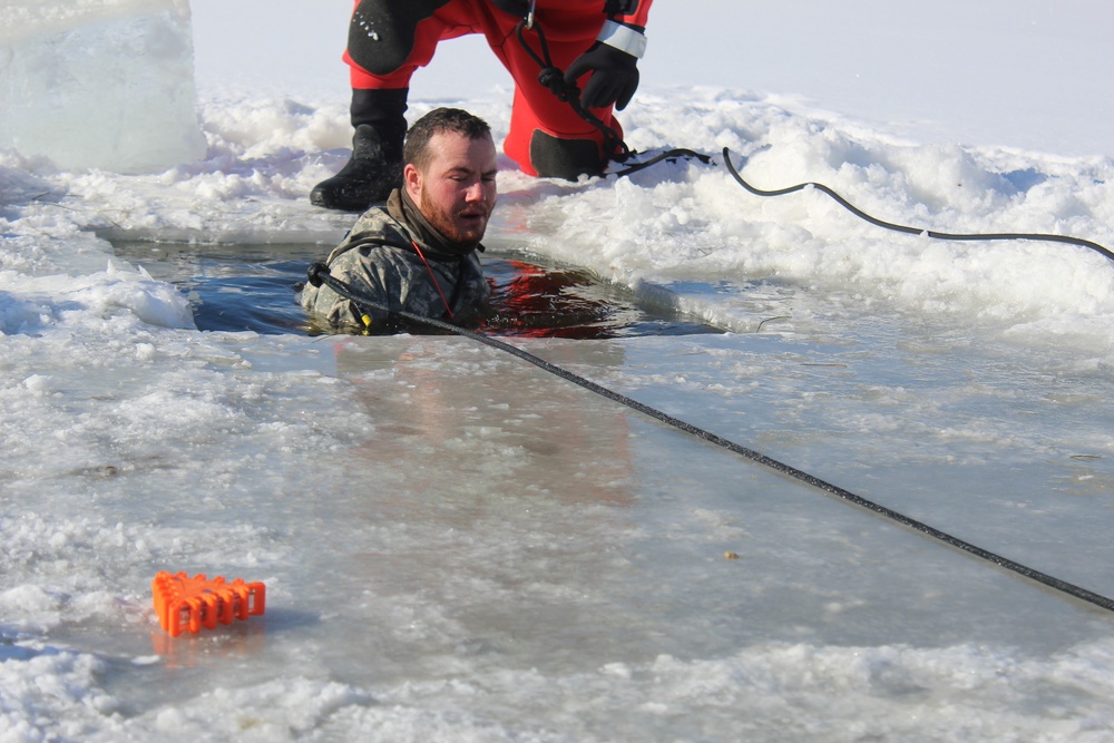 Students take plunge in icy water for Cold-Weather Operations Course 18-02 at Fort McCoy