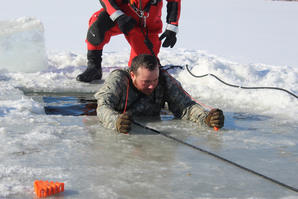 Students take plunge in icy water for Cold-Weather Operations Course 18-02 at Fort McCoy