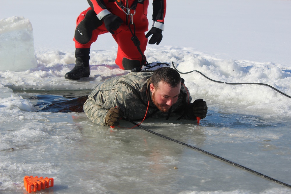 Students take plunge in icy water for Cold-Weather Operations Course 18-02 at Fort McCoy