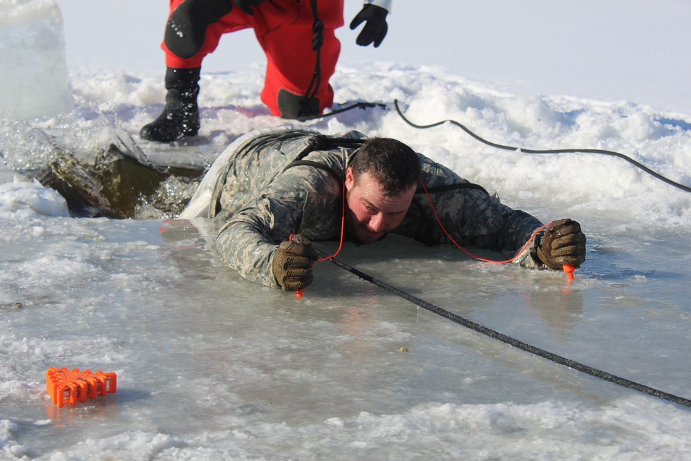 Students take plunge in icy water for Cold-Weather Operations Course 18-02 at Fort McCoy