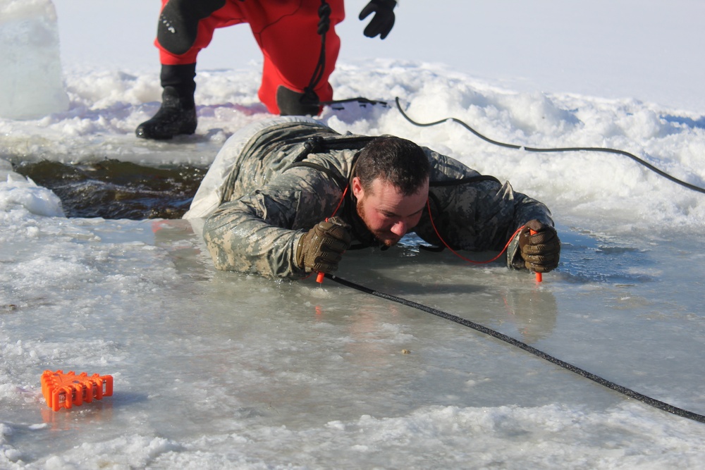 Students take plunge in icy water for Cold-Weather Operations Course 18-02 at Fort McCoy