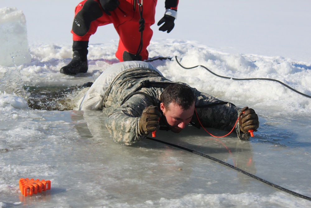 Students take plunge in icy water for Cold-Weather Operations Course 18-02 at Fort McCoy