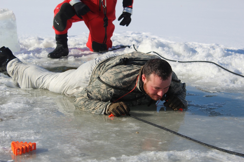 Students take plunge in icy water for Cold-Weather Operations Course 18-02 at Fort McCoy